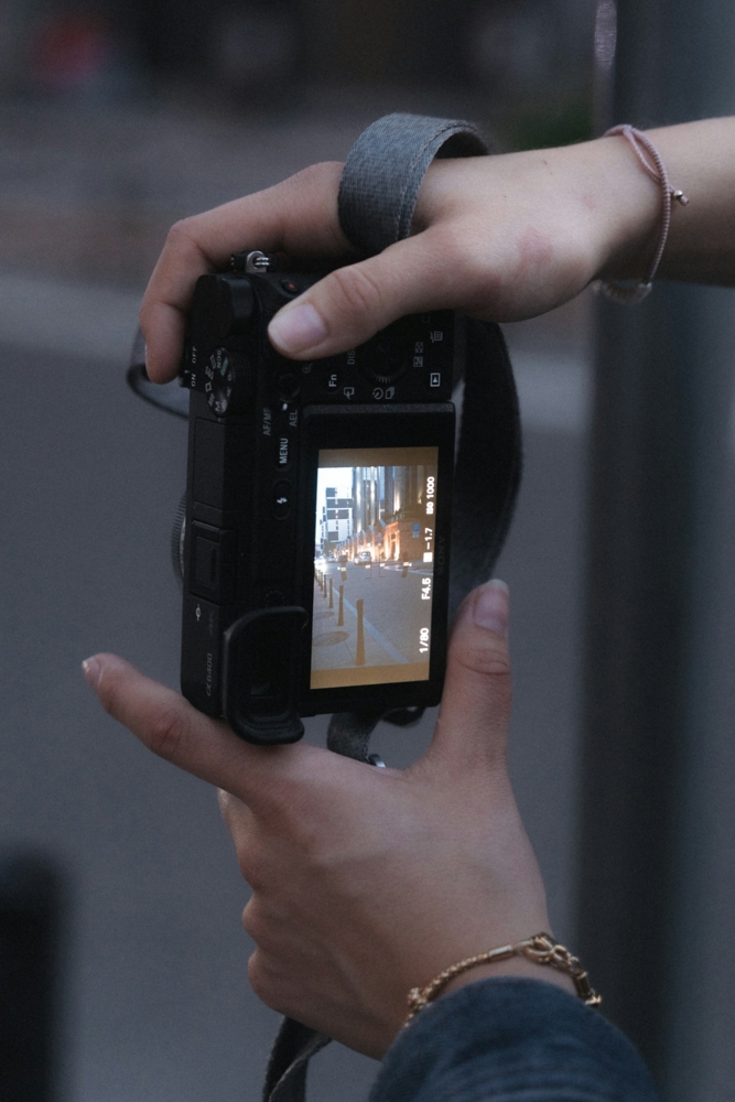 Hands holding a Sony A6400