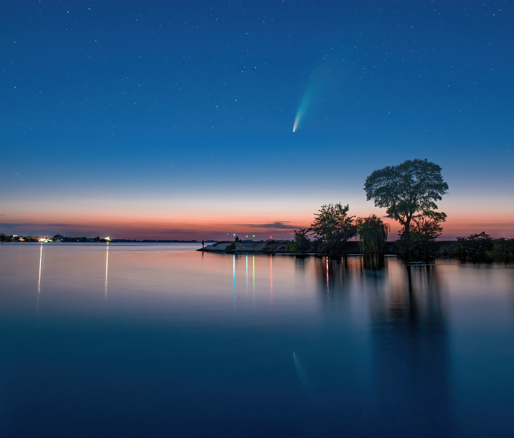 Comet C 2020 F3 Neowise in night sky above Dnieper river, Ukraine
