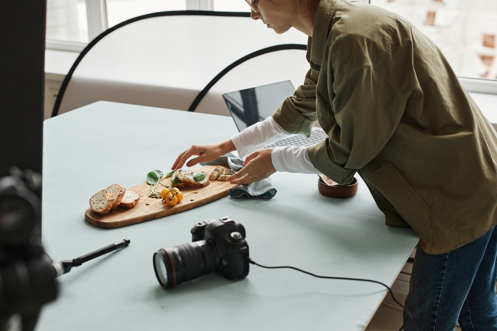 food photographer setting up food in the studio