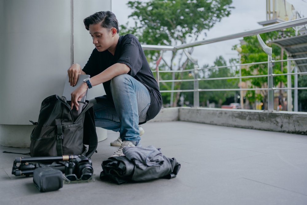 male photographer packing