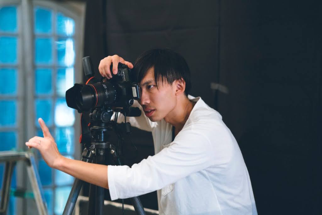 male portrait photographer in studio