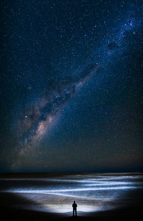 man at beach at night