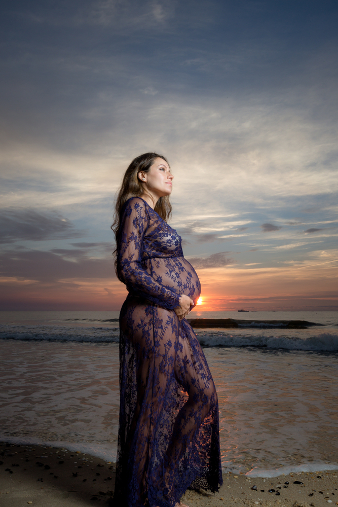 Maternity Photo of a woman standing on the beach