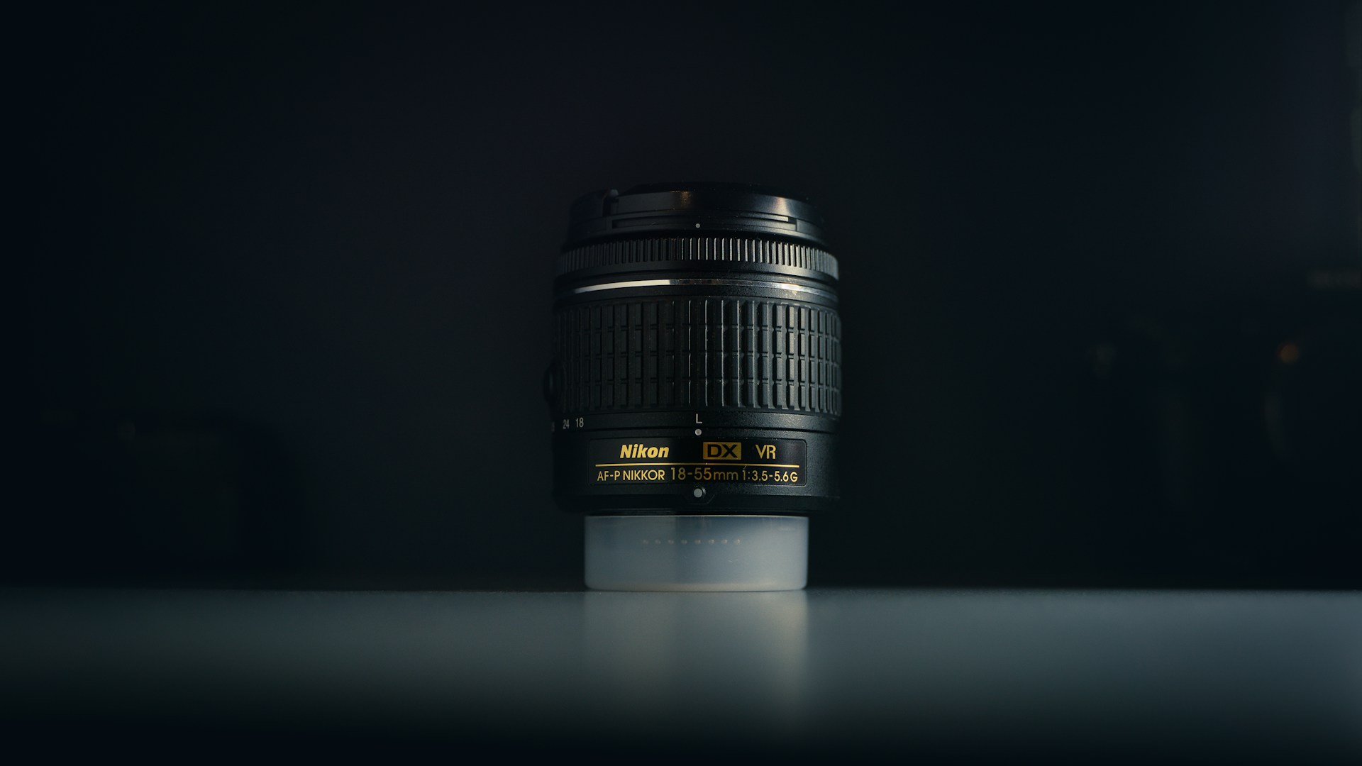 Nikkor 18-55mm Lens on a black background