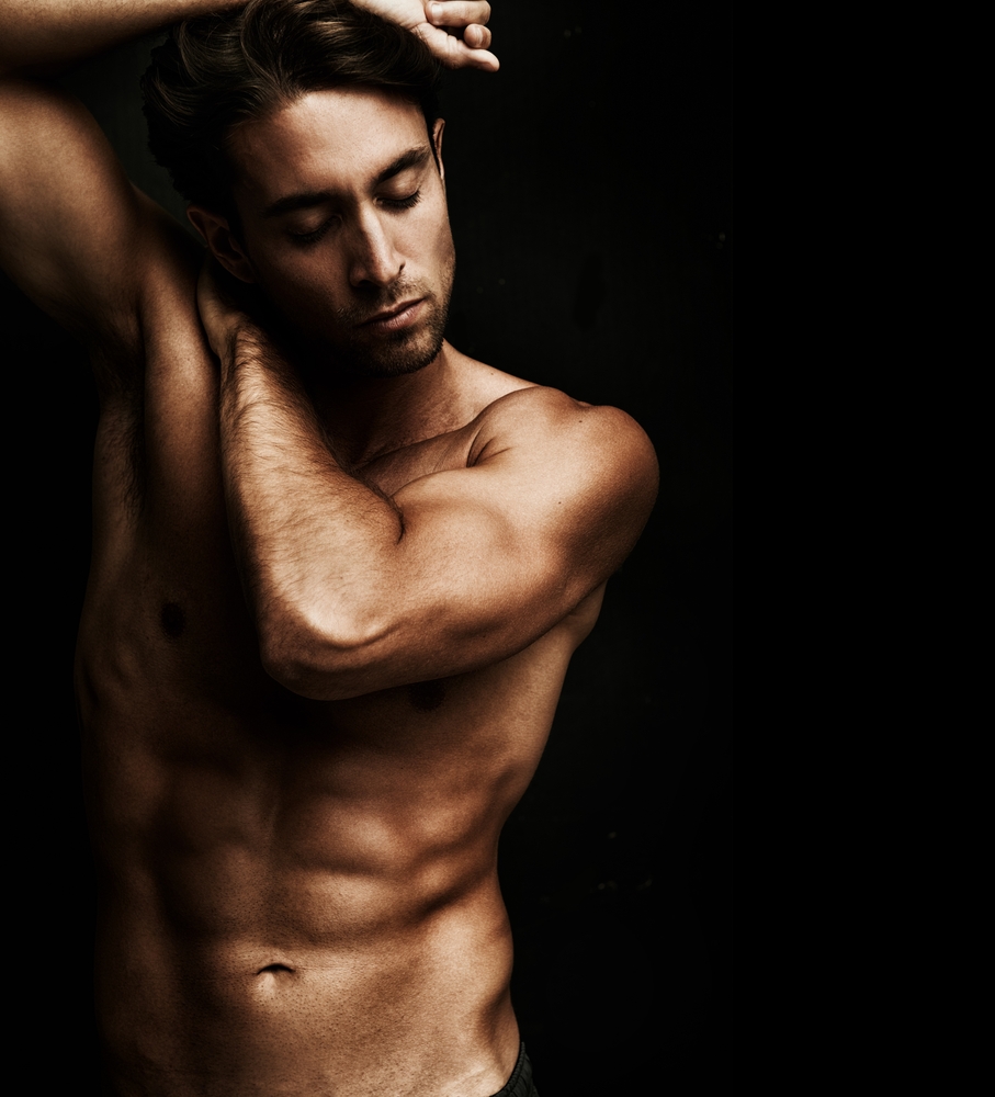 Nude Man against black background