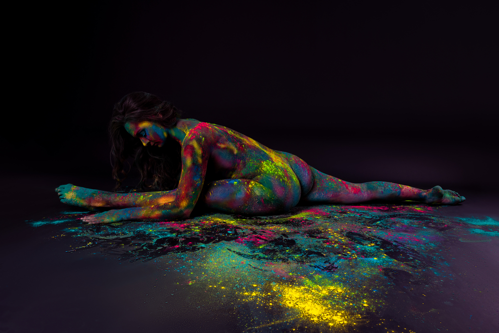 nude woman painted with powder paints