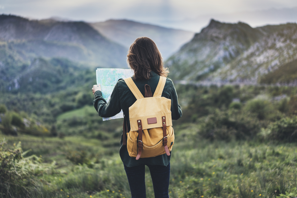photographer looking at a map