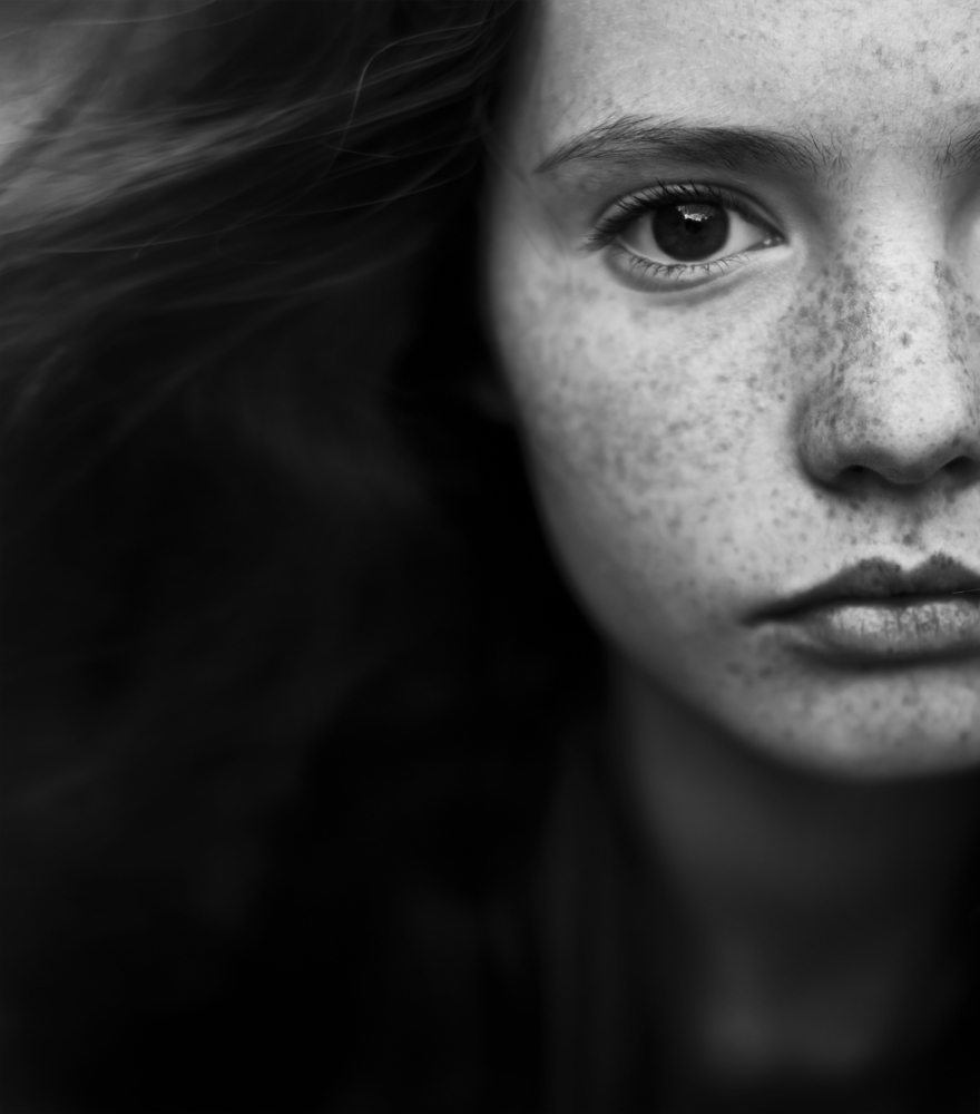 Portrait of a girl with freckles BW