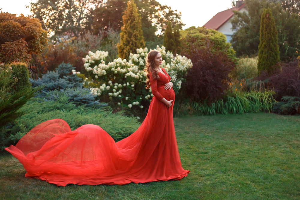 Pregnant woman in a flowing red dress