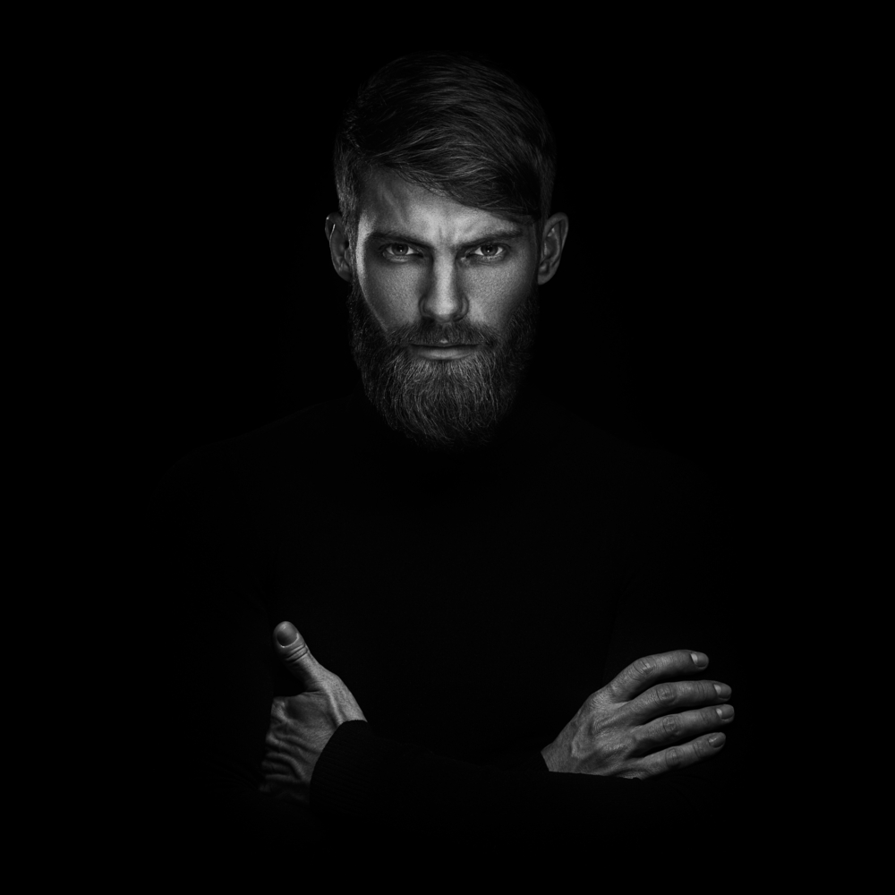 serious man with arms crossed BW