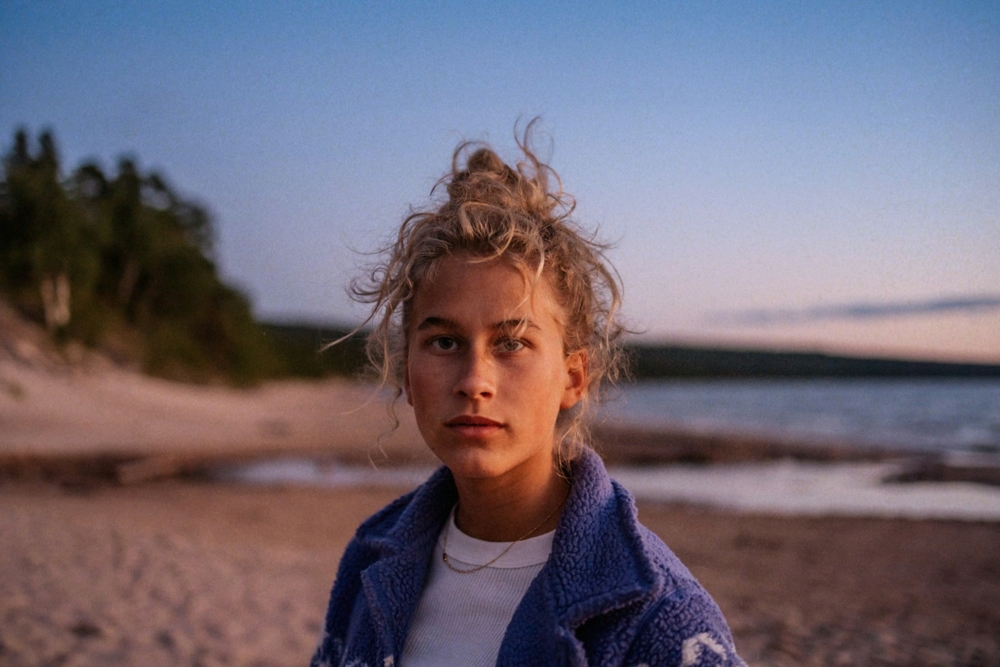Woman with curly hair on a beach